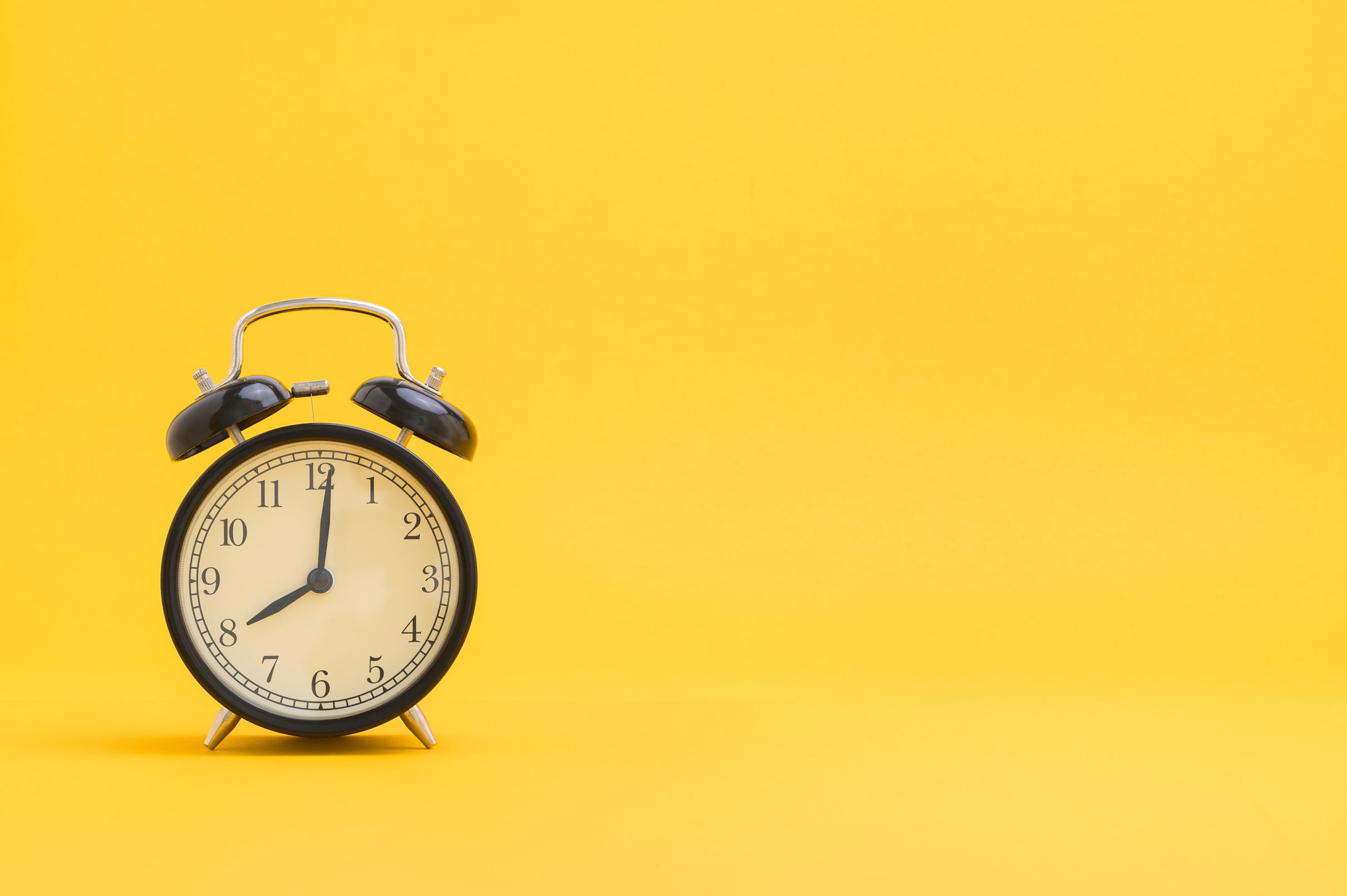 Clock against a Yellow Background